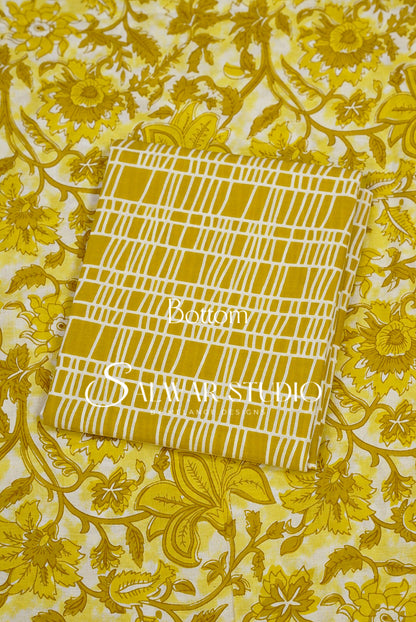 A folded fabric sample with a yellow and white grid pattern.