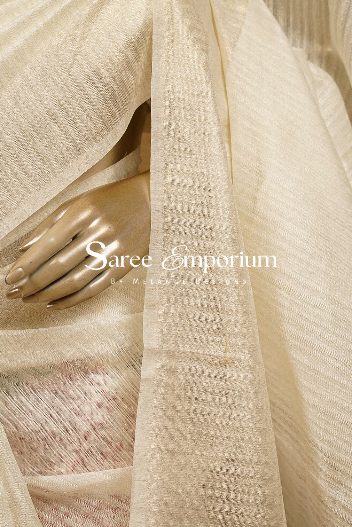 A close-up of a draped off white-colored Semi Matka Embroidery Saree .