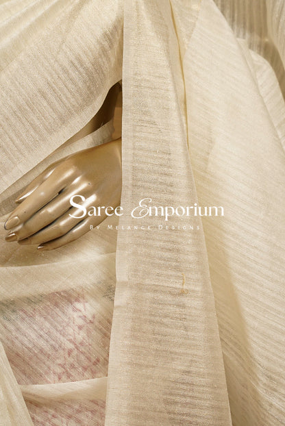 A close-up of a draped off white-colored Semi Matka Embroidery Saree .